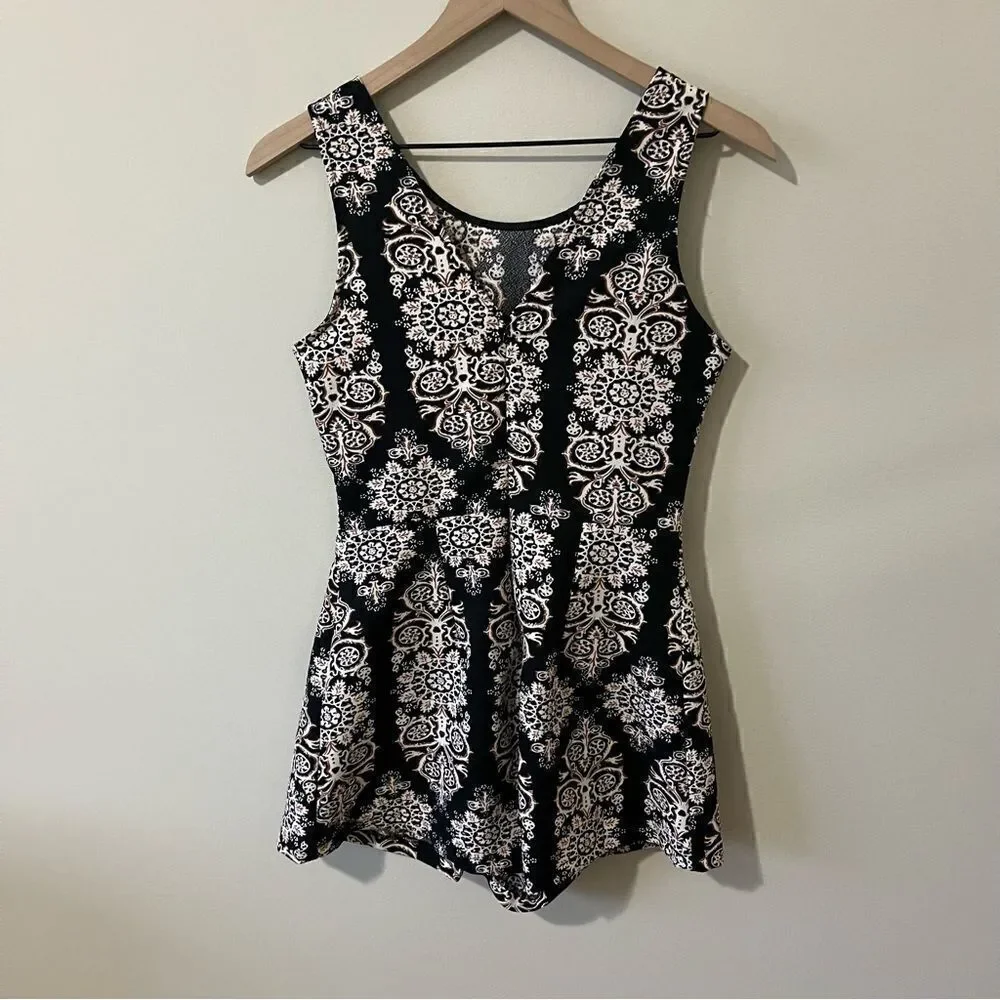 Lush  romper one piece Size small fun all over print sleeveless date